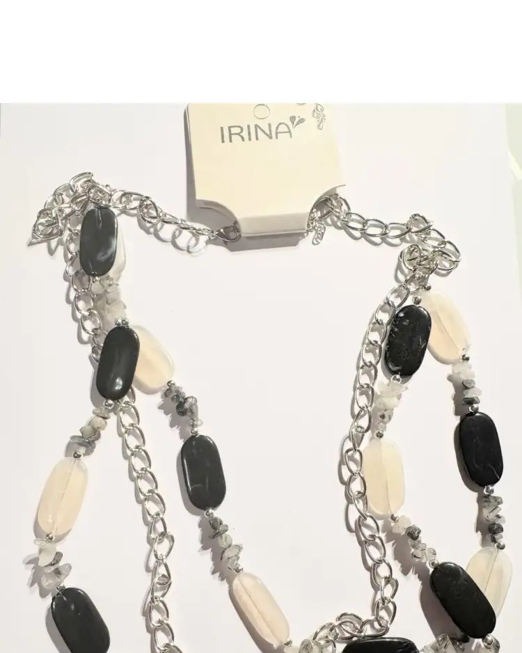 Long, exotic necklace with a silver patina.