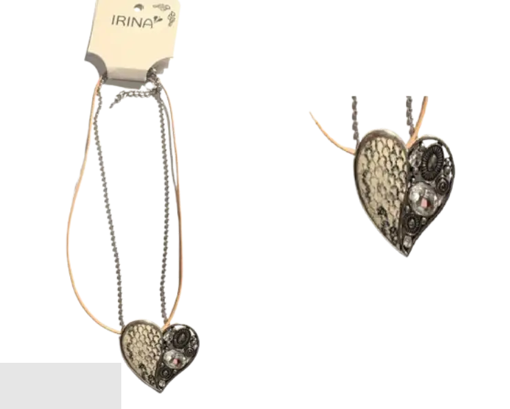 Necklace with a heart-shaped, sparkly stone, featuring a bold, designer aesthetic.