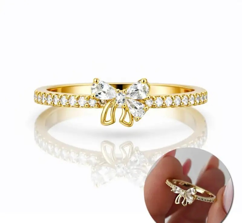 Surgical steel ring plated with 14k gold, BOW cubic zirconia PST994