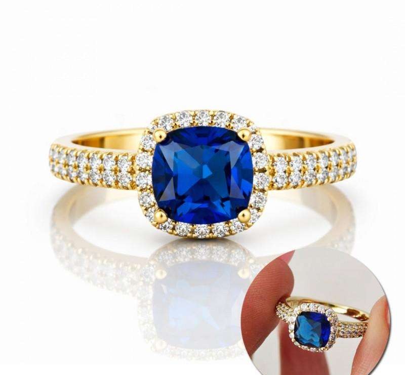 Surgical steel ring plated with 14k gold, with a striking blue zircon PST993